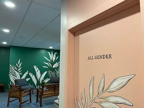 Waiting room and an all-gender restroom door